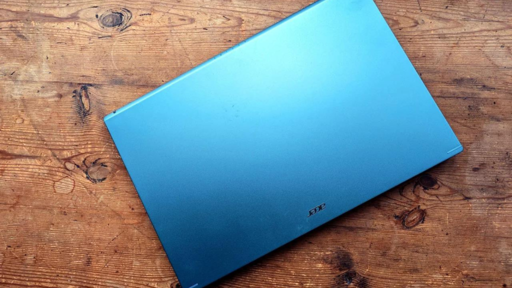 a blue color acer aspire 5 laptop on a table